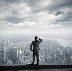 Man Overlooking City